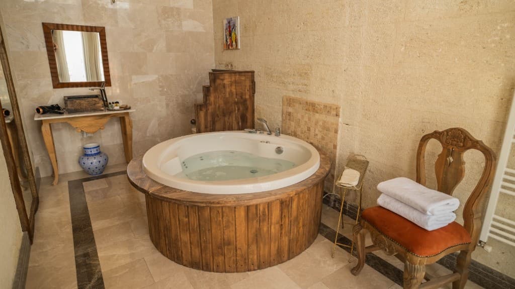 Stone bathroom and jacuzzi area